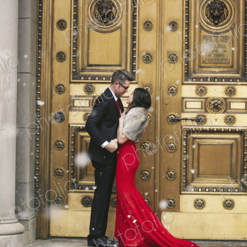 Man and woman, couple in evening dress outside in a city