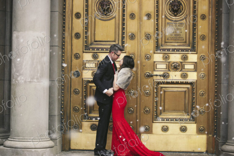Man and woman, couple in evening dress outside in a city