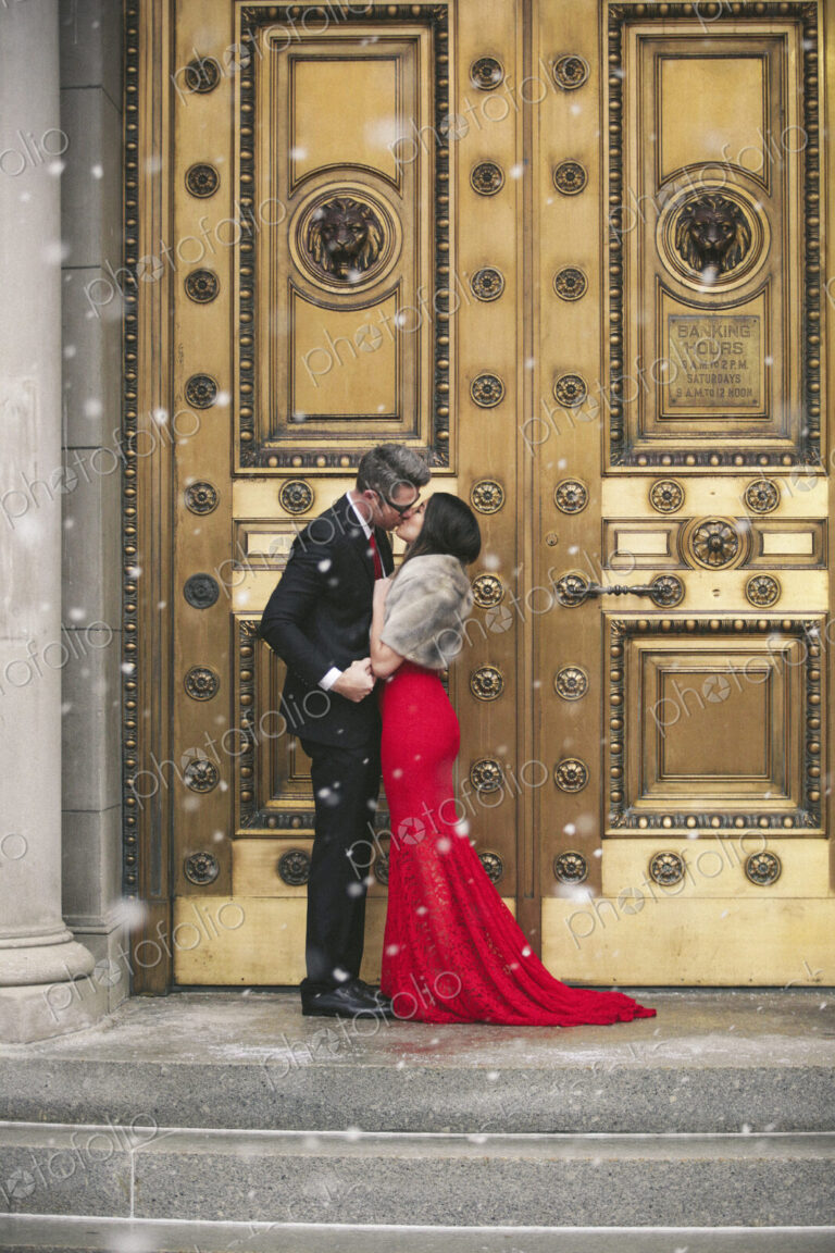 Man and woman, couple in evening dress outside in a city