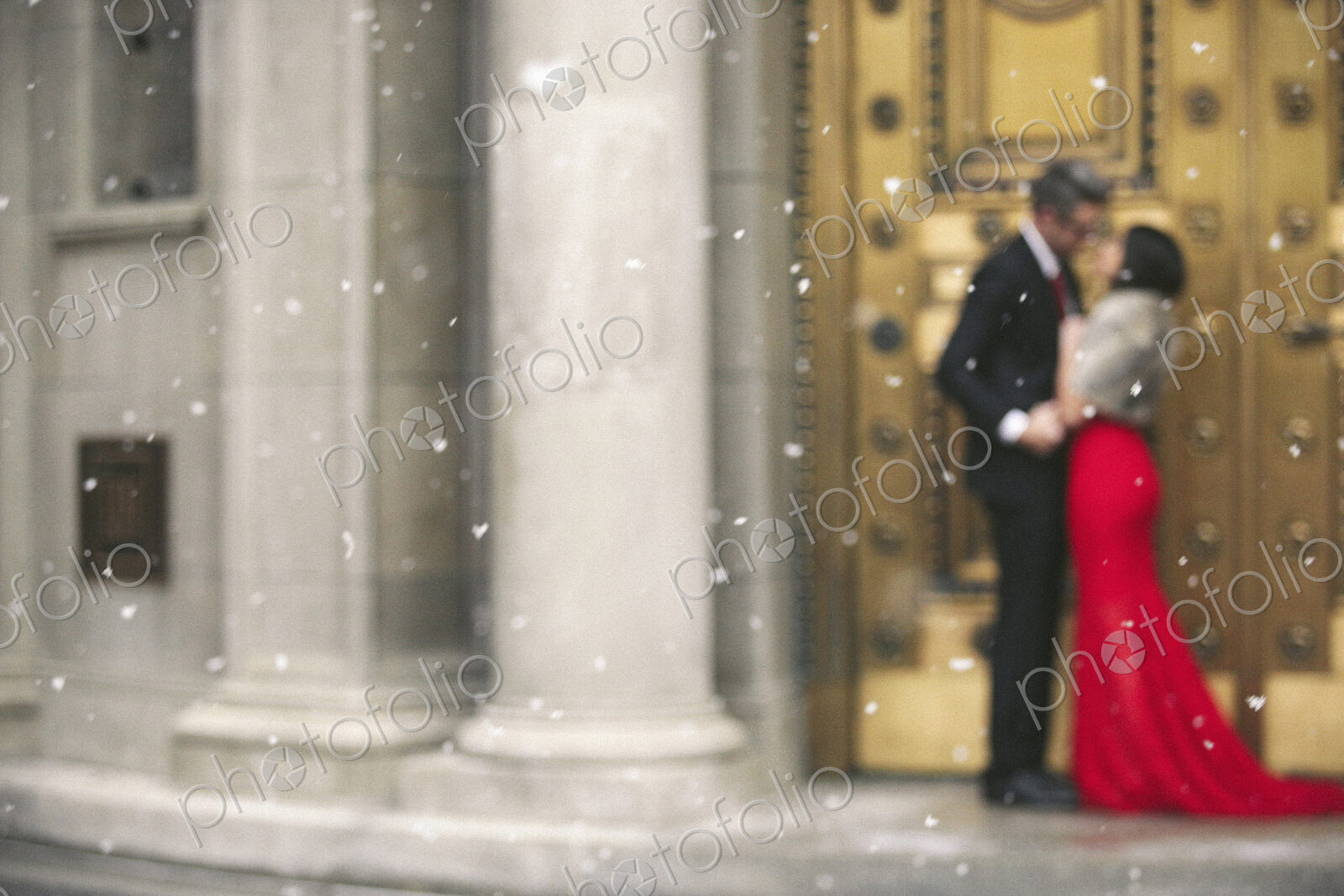 Man and woman, couple in evening dress outside in a city