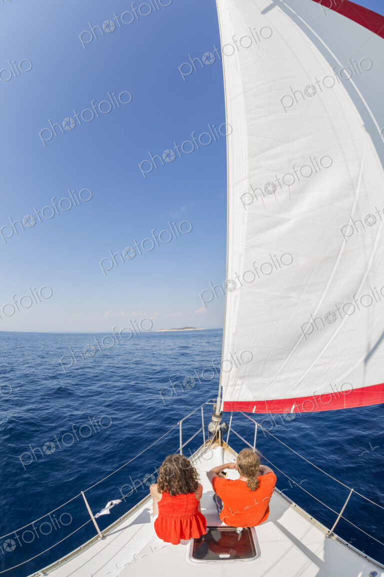 Man and woman on a sailing yacht on the Adriatic Sea.