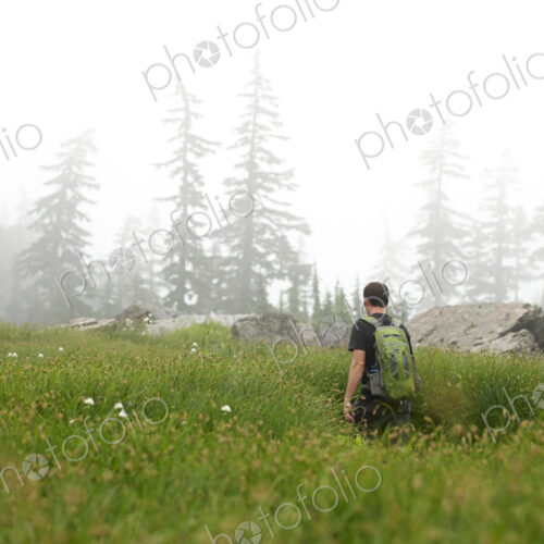 Man hiking in rural field