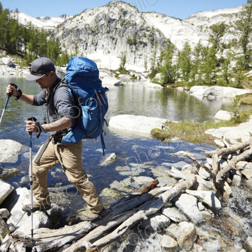 Man hiking near remote lake Man hiking near remote lake