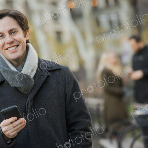 Man in urban park with smartphone Man in urban park with smartphone
