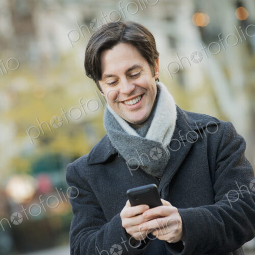Man in urban park with smartphone Man in urban park with smartphone