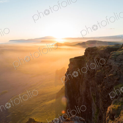 Man looking at the view at sunset from Dyrholaey Peninsula, near Vik, South Iceland… Man looking at the view at sunset from Dyrholaey Peninsula, near Vik, South Iceland…
