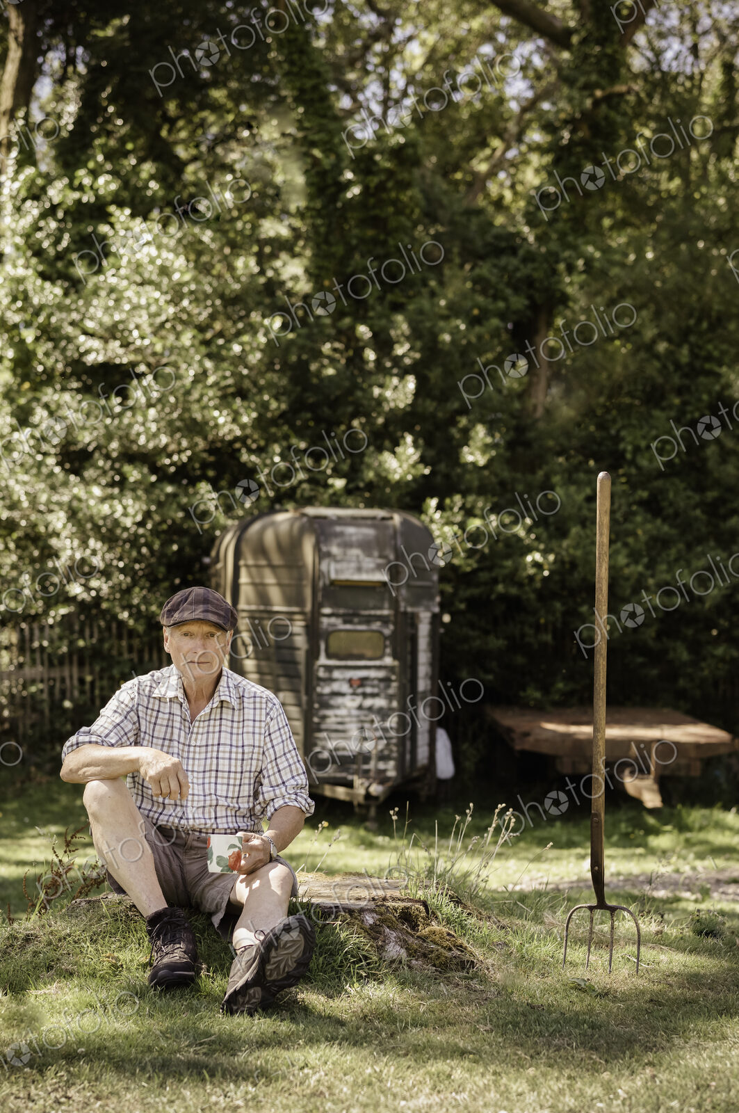 Man sitting in a garden.