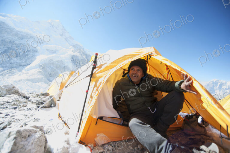Man sitting in base camp tent, Everest, Khumbu glacier, Nepal