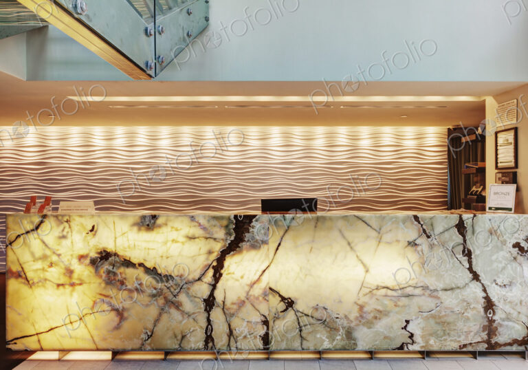 Marble reception desk in hotel lobby