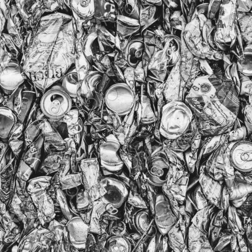 Mass of aluminium cans being processed at a recycling plant.