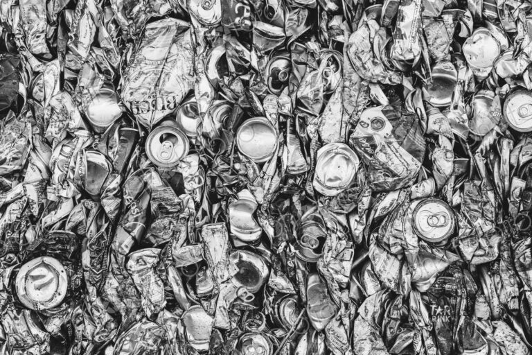 Mass of aluminium cans being processed at a recycling plant.