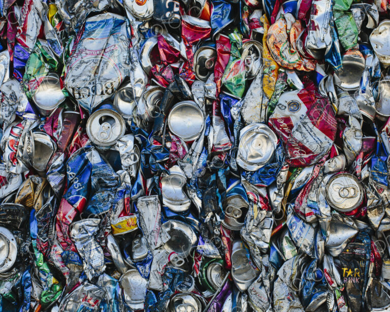 Mass of aluminium cans being processed at a recycling plant.