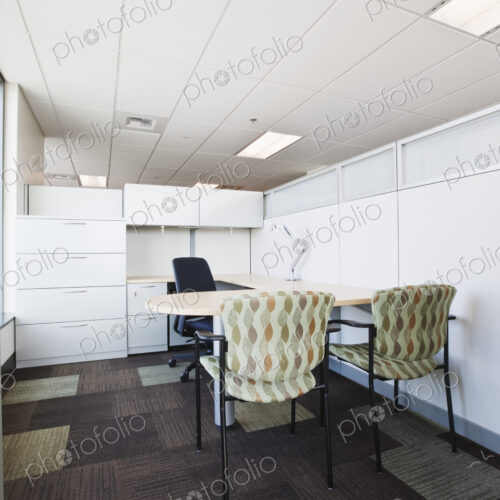 Meeting room in office with chairs at desk. Meeting room in office with chairs at desk.