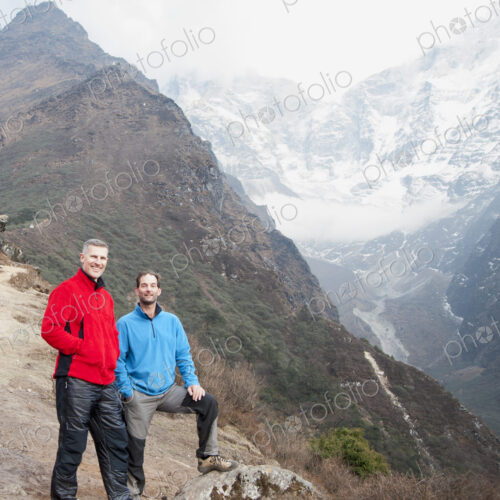 Men posing on mountain Men posing on mountain