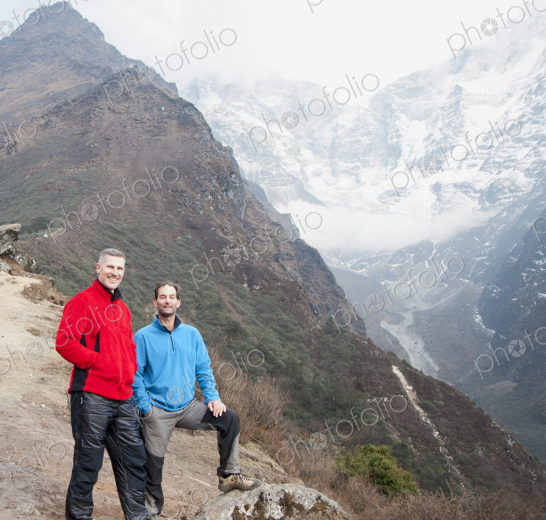 Men posing on mountain
