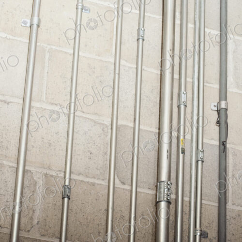 Metal casing for wires on concrete wall. Metal casing for wires on concrete wall.