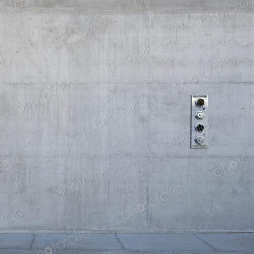 Metal control panel on concrete wall. Metal control panel on concrete wall.