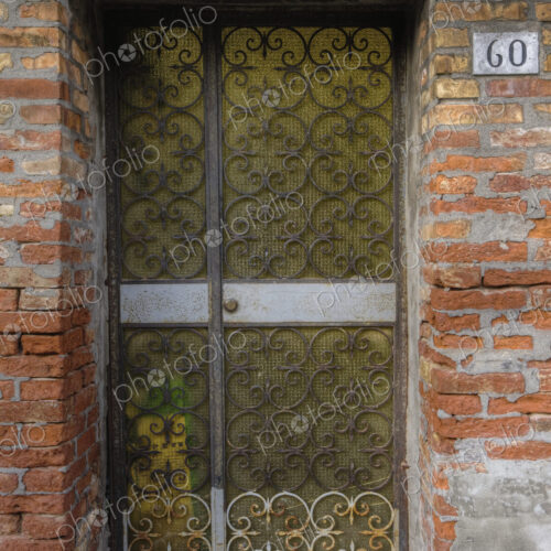 Metal gate in brick wall.