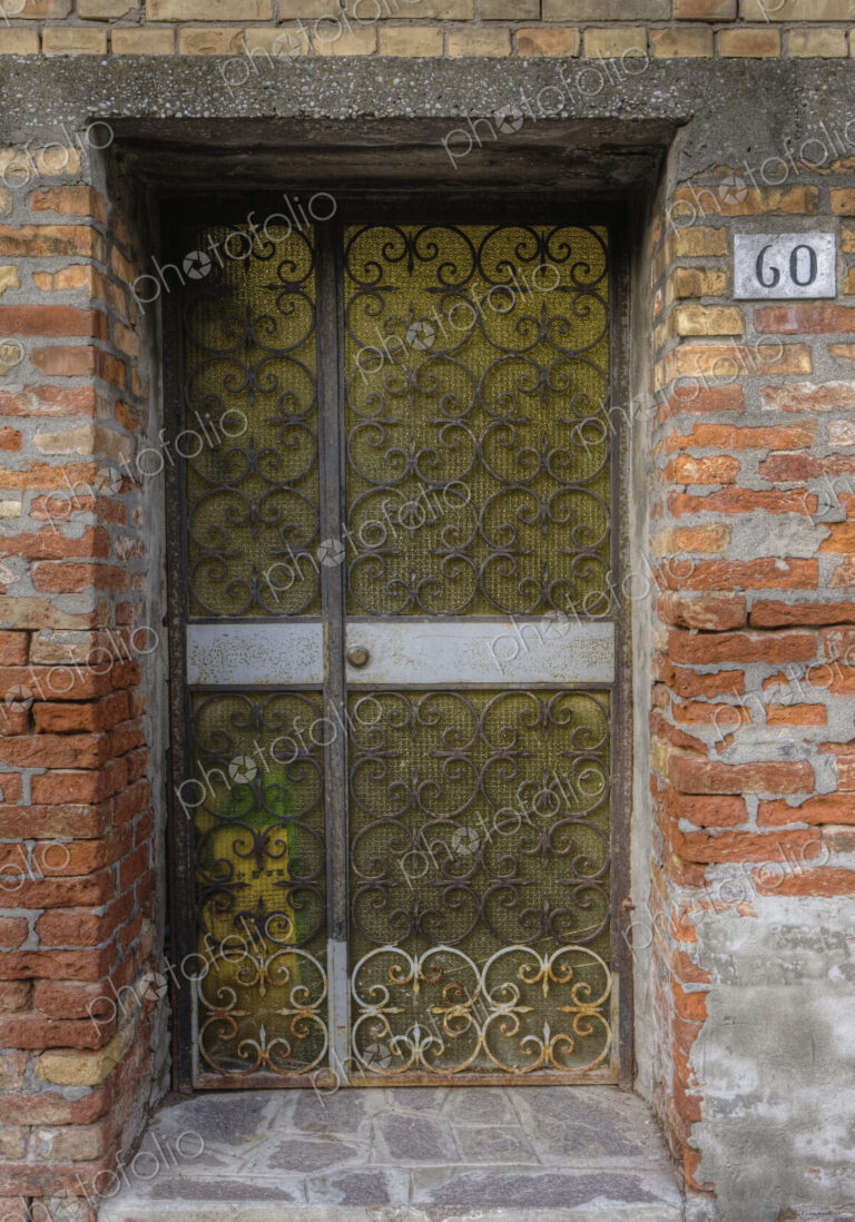 Metal gate in brick wall.