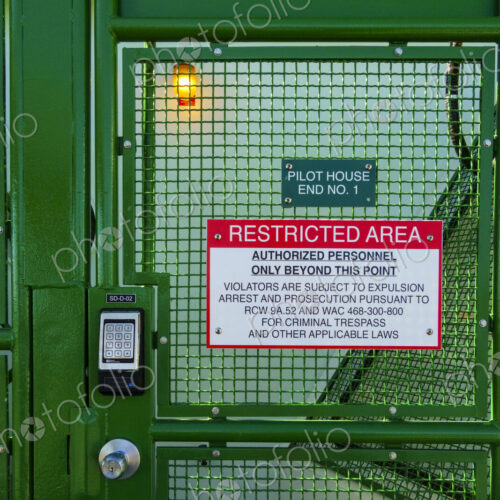 Metal locked gate on the dock by the Washington State Ferry Metal locked gate on the dock by the Washington State Ferry