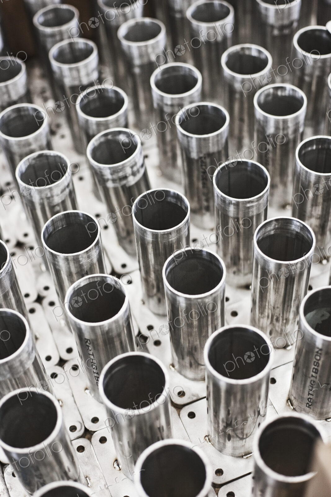 Metal tubes with base plates for feet.