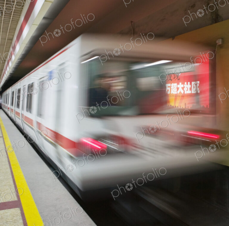 Metro train leaving subway railway station.