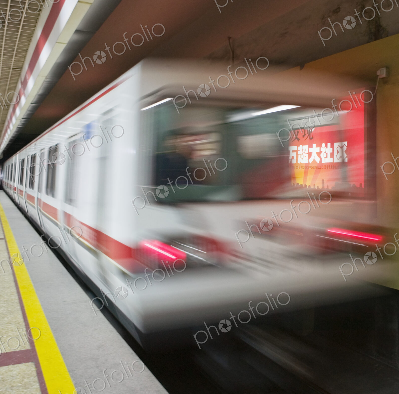 Metro train leaving subway railway station.