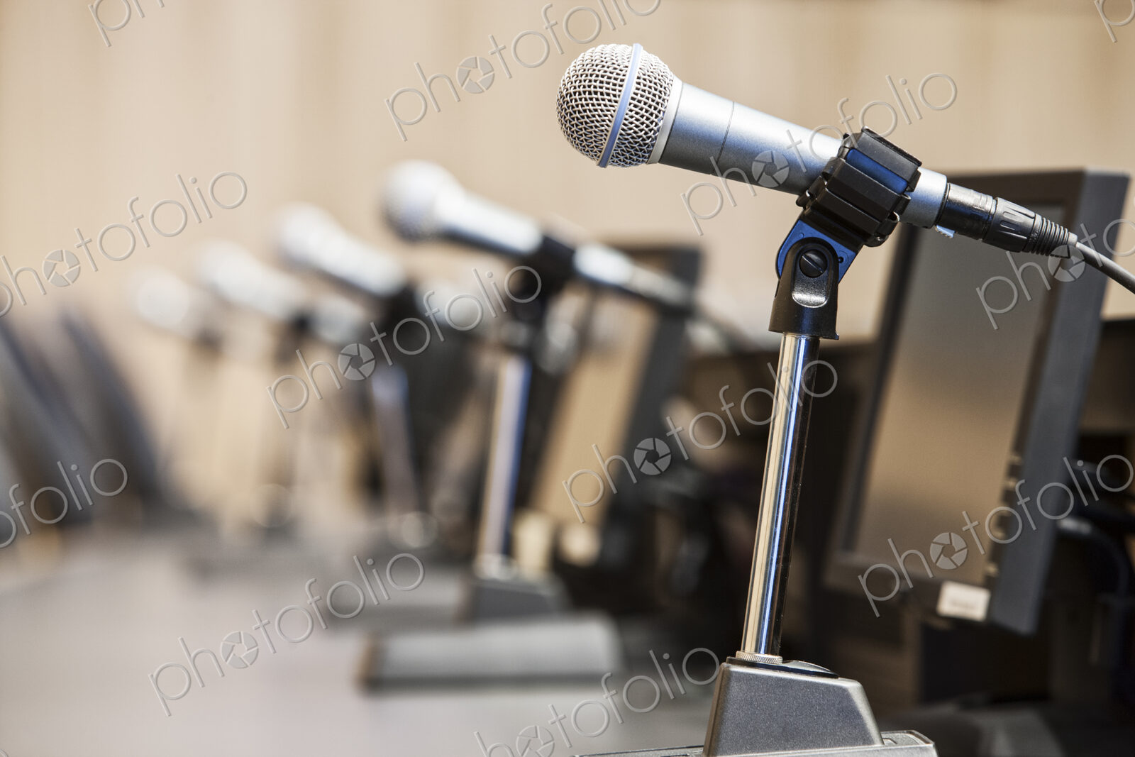 Microphones at a political meeing in city hall.