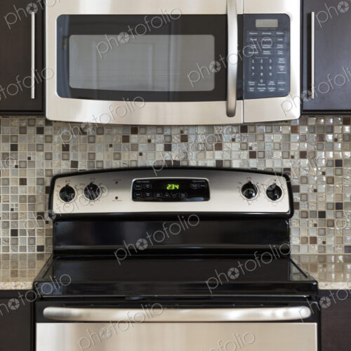 Microwave and stove in modern kitchen Microwave and stove in modern kitchen