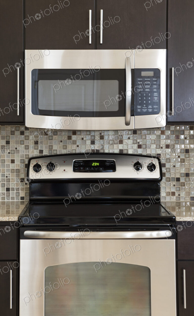 Microwave and stove in modern kitchen