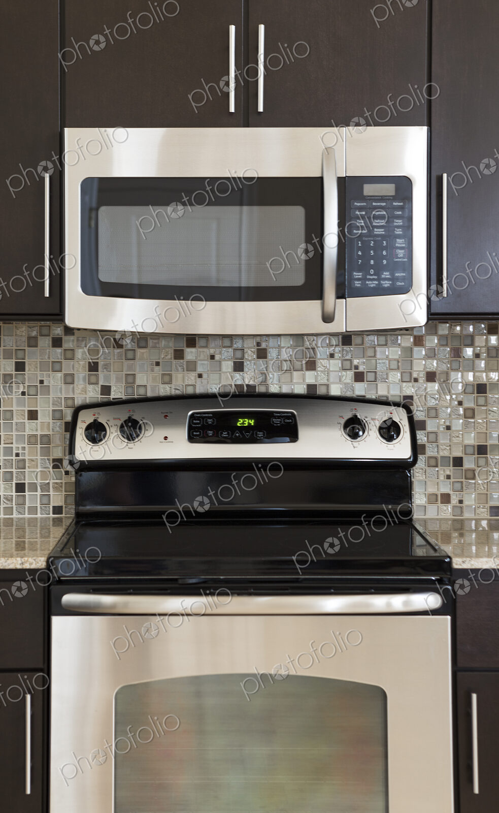Microwave and stove in modern kitchen
