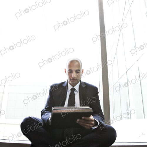 Middle eastern businessman working on a notebook computer