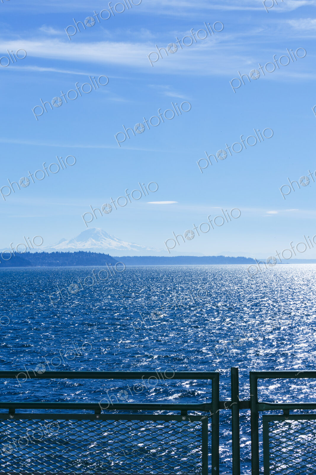 Middle of Puget Sound from a Puget Sound ferry in windy blue sky conditions, near…
