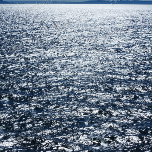 Middle of Puget Sound in windy blue sky conditions, near Seattle, WA USA Middle of Puget Sound in windy blue sky conditions, near Seattle, WA USA