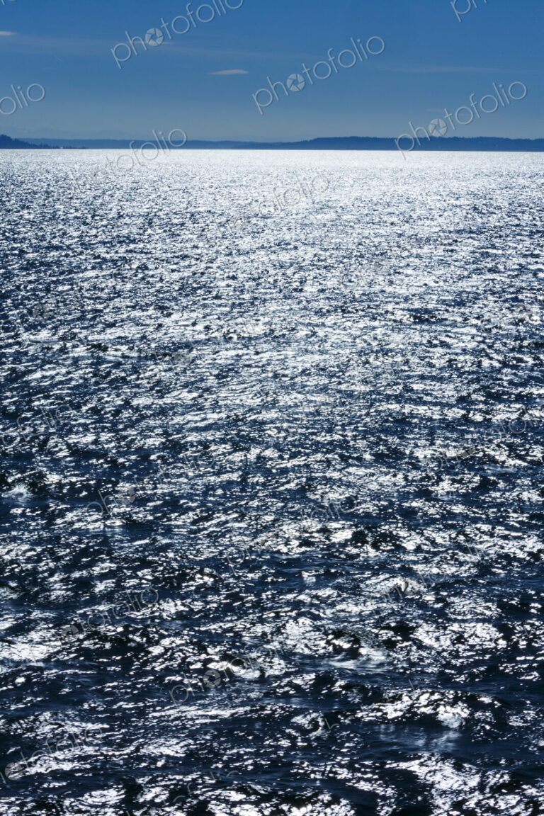 Middle of Puget Sound in windy blue sky conditions, near Seattle, WA USA