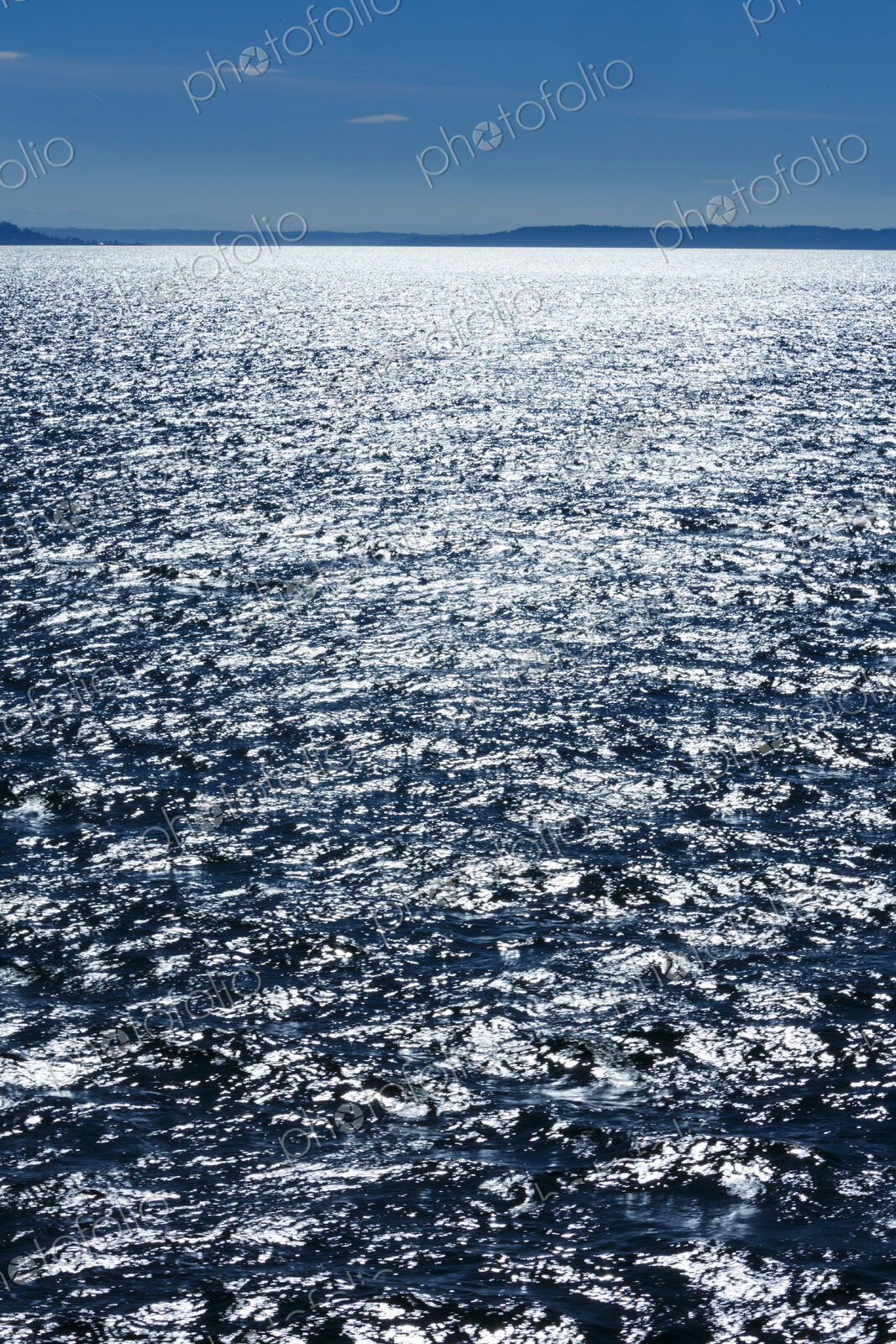 Middle of Puget Sound in windy blue sky conditions, near Seattle, WA USA