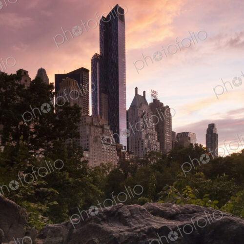 Midtown Manhattan skyline at dusk, dominated by the One57 skyscraper and the Essex… Midtown Manhattan skyline at dusk, dominated by the One57 skyscraper and the Essex…