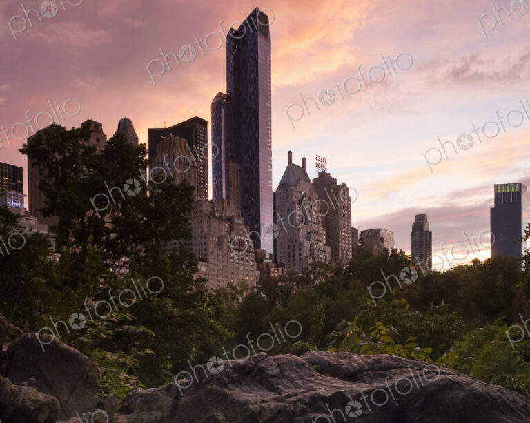 Midtown Manhattan skyline at dusk, dominated by the One57 skyscraper and the Essex…