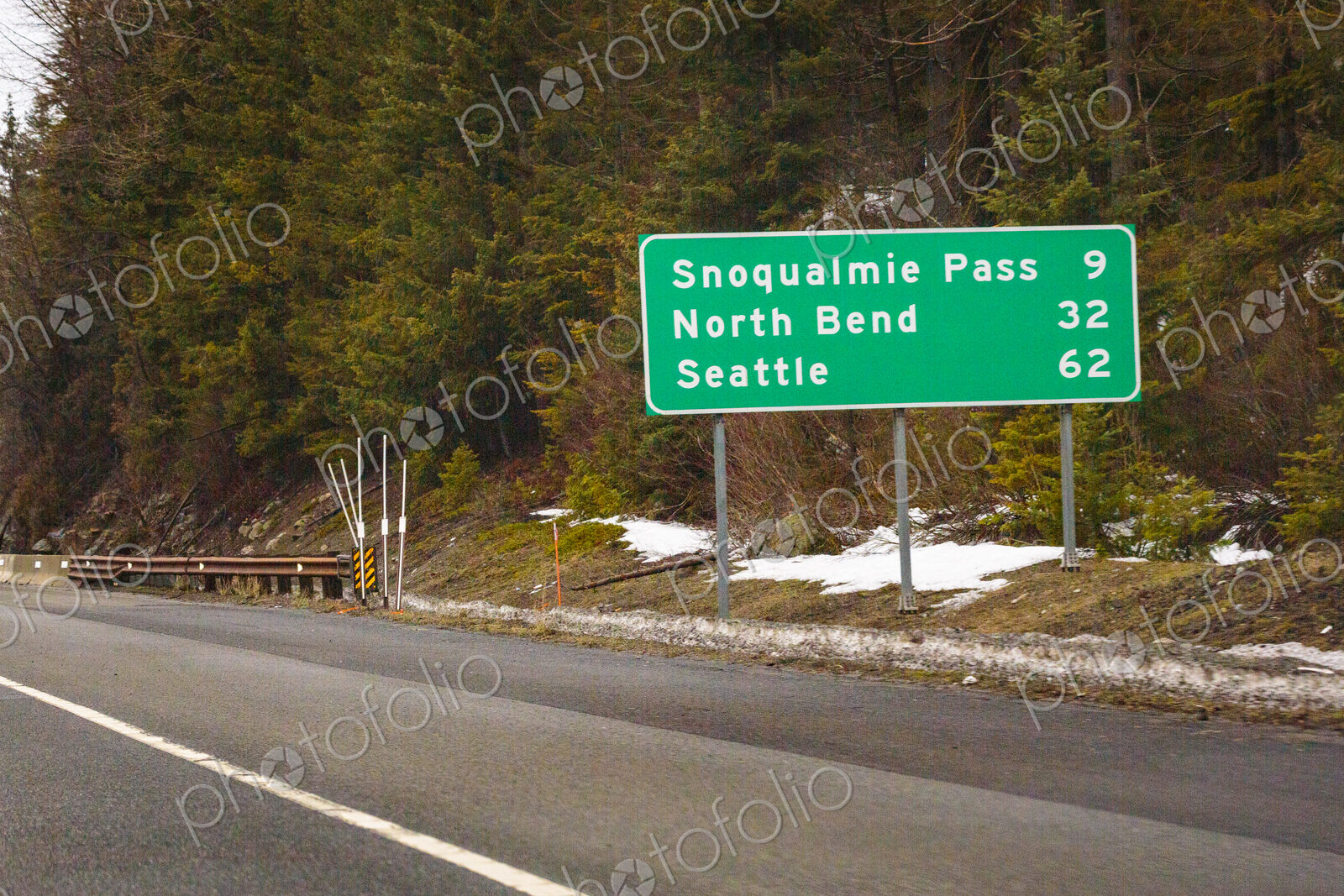 Mileage road sign on Interstate 90.