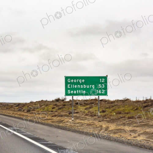 Mileage sign on the highway, Interstate 90, Washington state Mileage sign on the highway, Interstate 90, Washington state