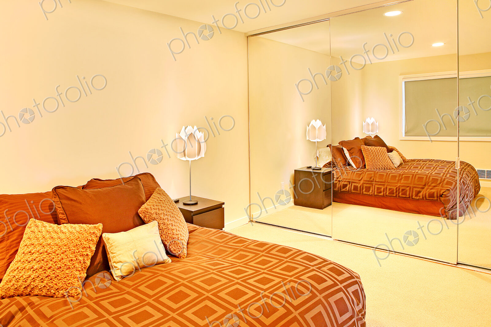 Mirror on wall of modern bedroom