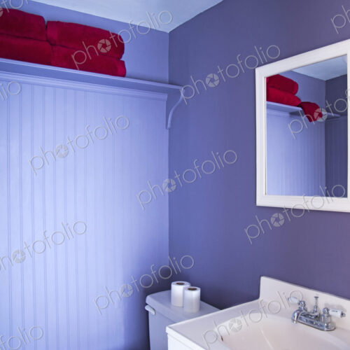 Mirror, sink and toilet in modern bathroom Mirror, sink and toilet in modern bathroom
