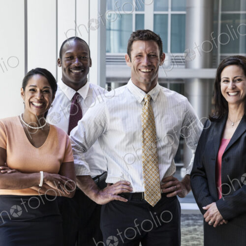 Mixed race business people together as a team in a business center.