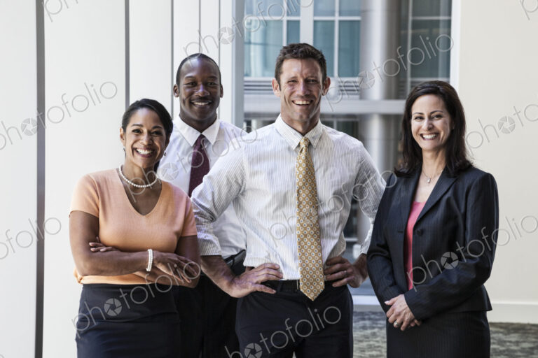 Mixed race business people together as a team in a business center.