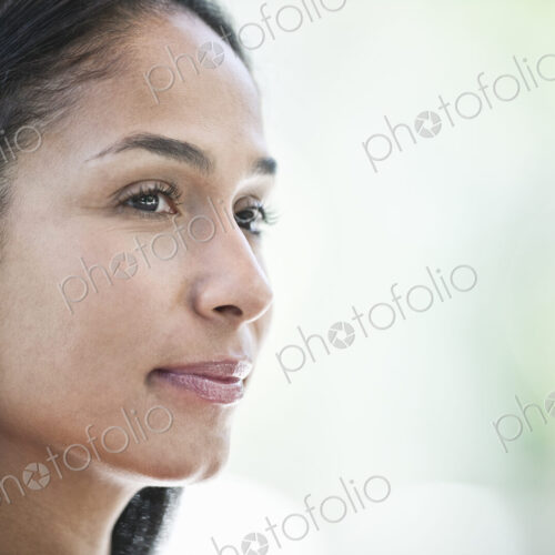 Mixed race caucasian woman in a business center lobby.