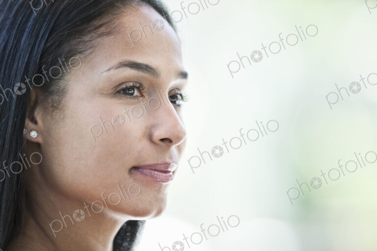 Mixed race caucasian woman in a business center lobby.