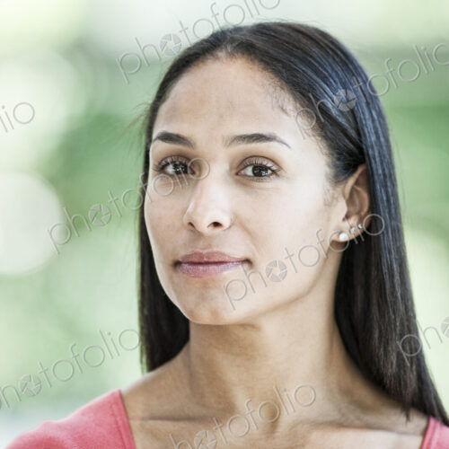 Mixed race caucasian woman in a business center lobby. Mixed race caucasian woman in a business center lobby.