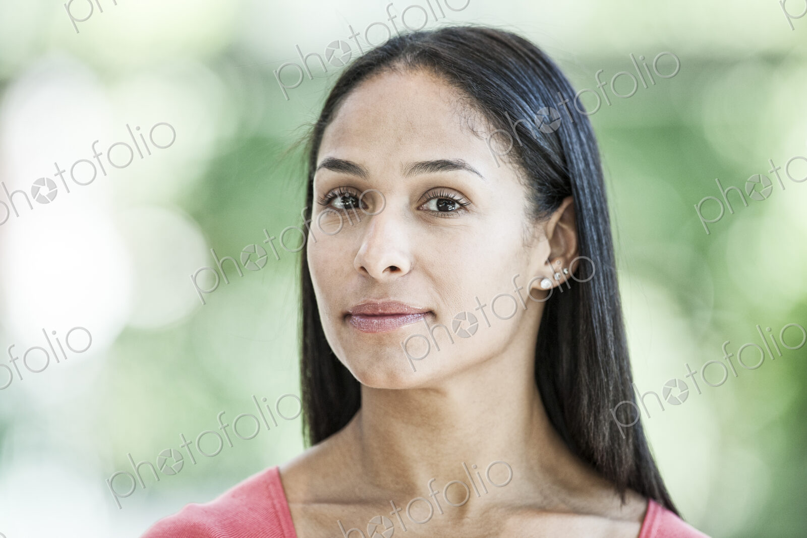 Mixed race caucasian woman in a business center lobby.