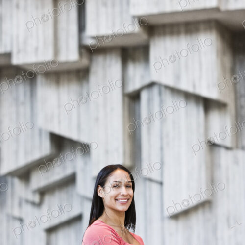 Mixed race caucasian woman in a business center lobby. Mixed race caucasian woman in a business center lobby.