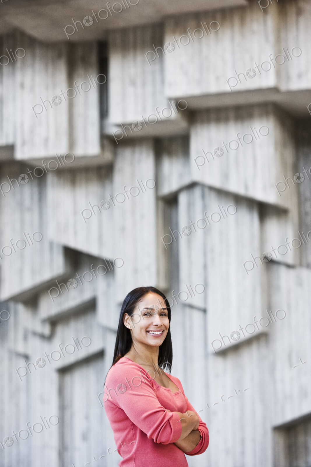 Mixed race caucasian woman in a business center lobby.